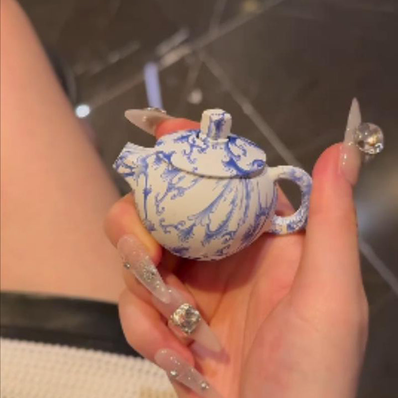 Blue and white porcelain teapot lighter with pink flame, refillable lighter