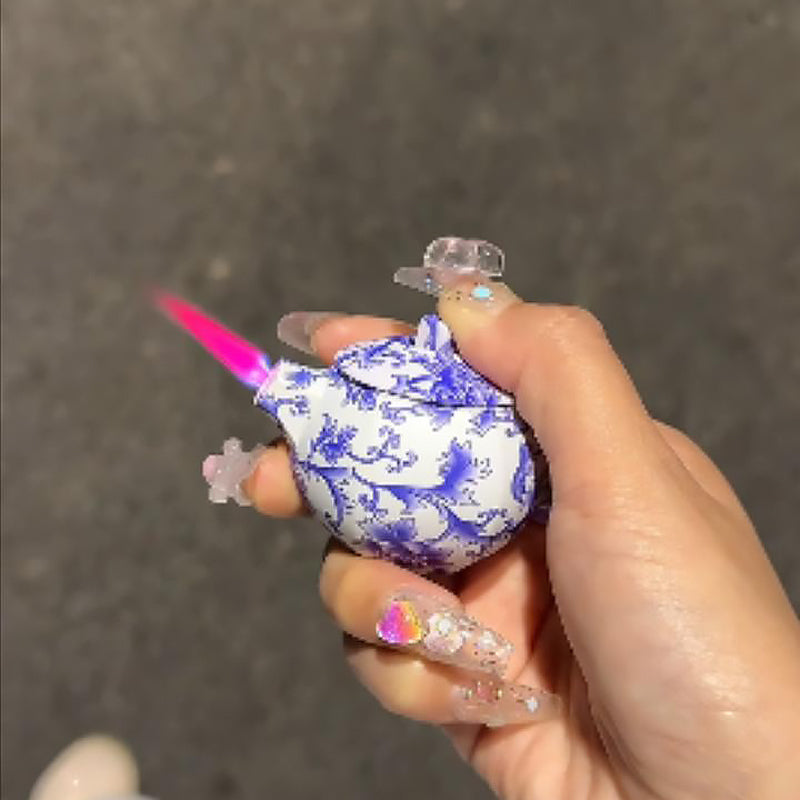 Blue and white porcelain teapot lighter with pink flame, refillable lighter