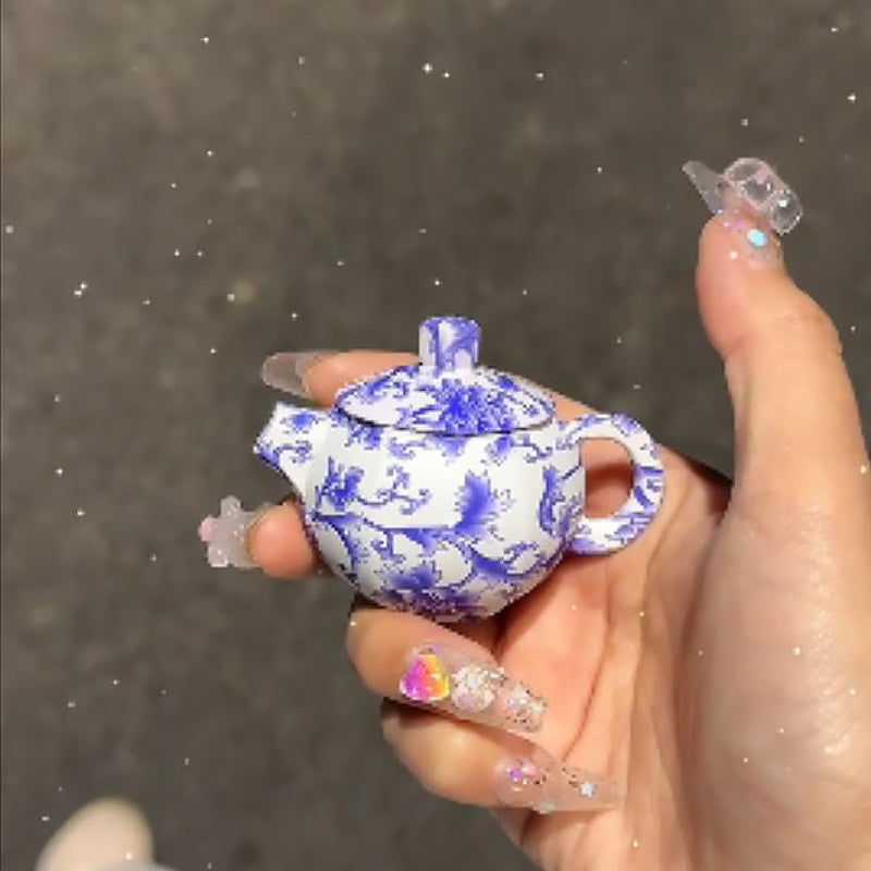 Blue and white porcelain teapot lighter with pink flame, refillable lighter