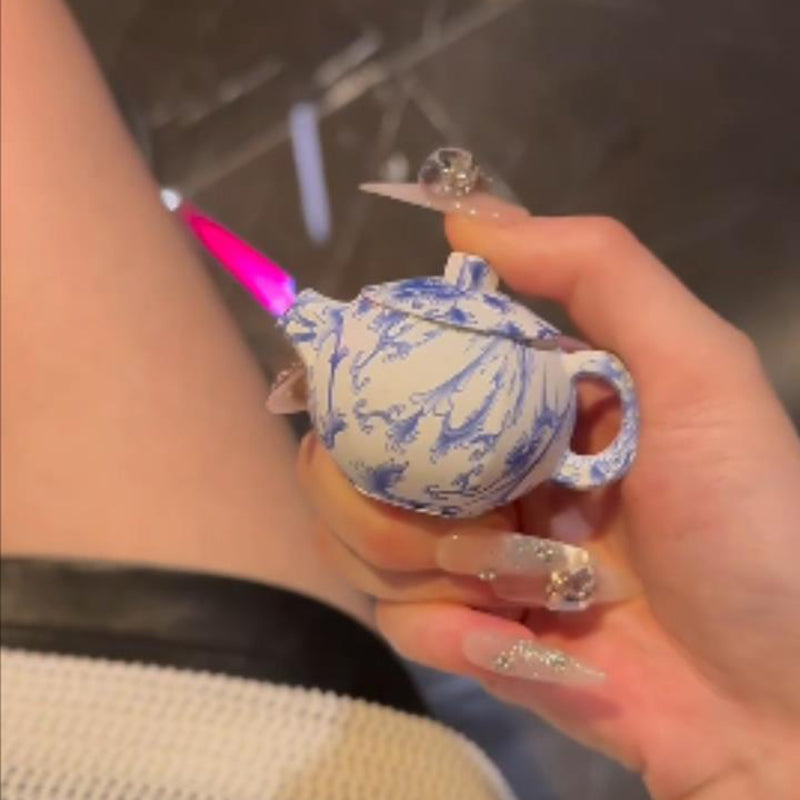 Blue and white porcelain teapot lighter with pink flame, refillable lighter
